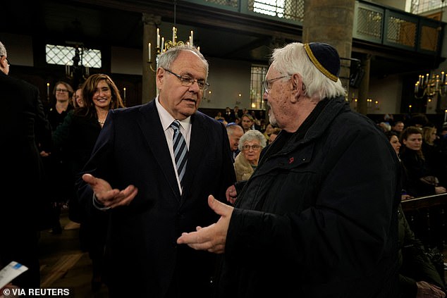 People attend the opening of the National Holocaust Museum in Amsterdam