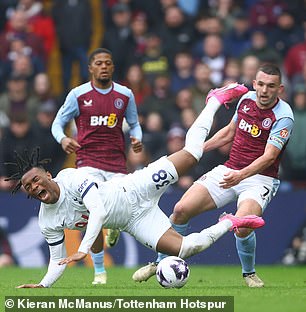 The Spurs full-back fell to the ground in pain after the challenge