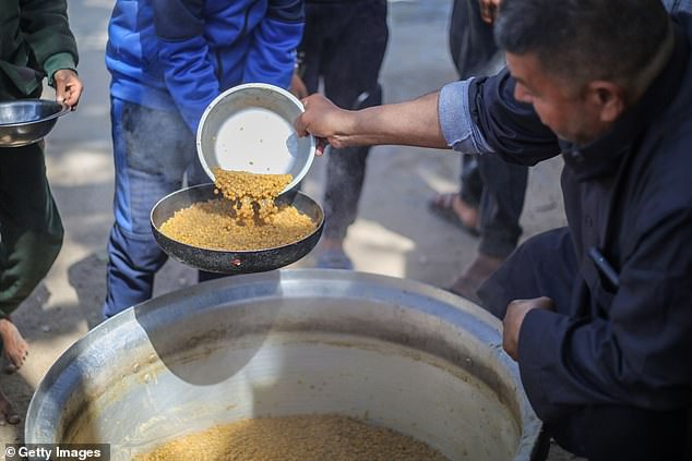 In Gaza, displaced Palestinians lined up at a truck with scarce drinking water, which they filled into jerry cans and plastic containers.