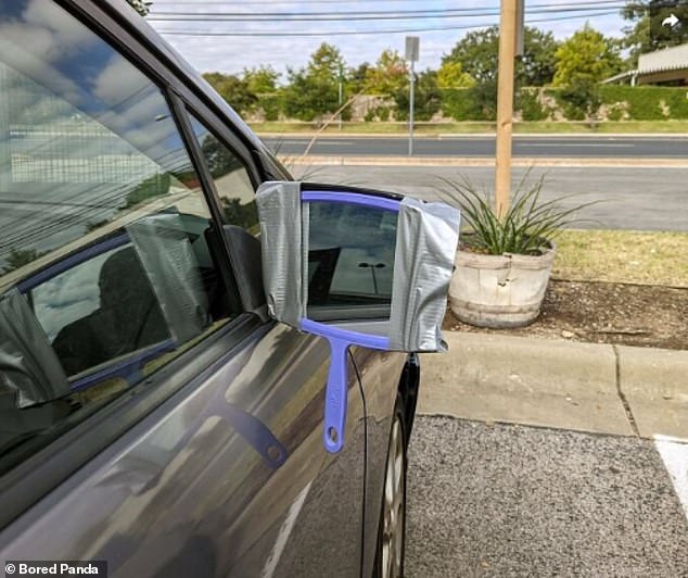 A brave person thought it wise to replace his car's broken side mirror not with a new part, but with a hand mirror held in place with duct tape