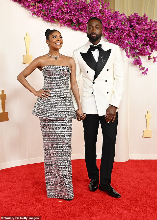 The couple sweetly held hands on the red carpet