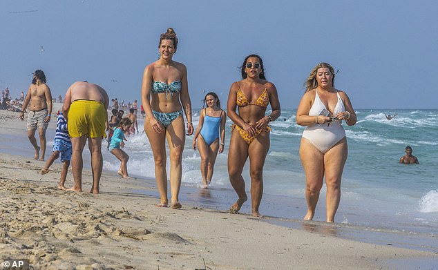 Beachgoers enjoy the beautiful weather during spring break in Miami Beach, Florida, Saturday, March 9, 2024