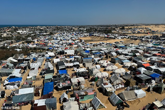 Displaced Palestinians take shelter in a tent camp, amid the ongoing conflict between Israel and the Palestinian Islamist terror group Hamas, in Rafah, southern Gaza Strip