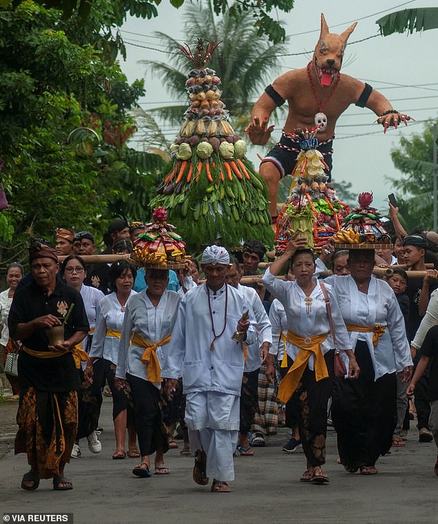 Hindu worshipers parade ogoh-ogoh figures during Ngrupuk on the night before Nyepi and make noise to attract evil spirits, who find the island deserted the next day and leave