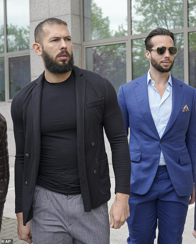 FILE: Andrew Tate, left, and his brother Tristan, center, arrive at the Bucharest Tribunal in Bucharest, Romania, Friday, April 21, 2023