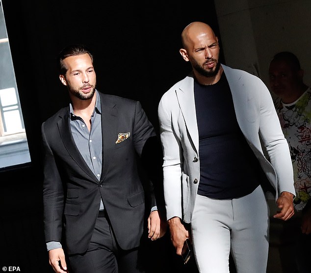 Former professional kickboxer and social media influencer Andrew Tate (C), followed by his brother Tristan (L), arrives for an appeal against preventive detention at the Bucharest Court of Appeal, in Bucharest, Romania, August 1, 2023