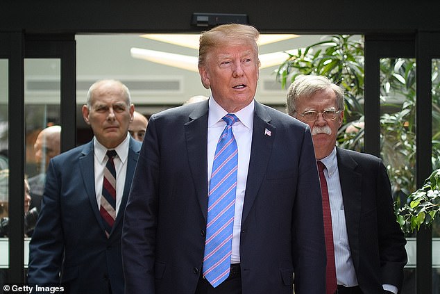 Trump pictured with former Chief of Staff John Kelly and former National Security Advisor John Bolton in 2018