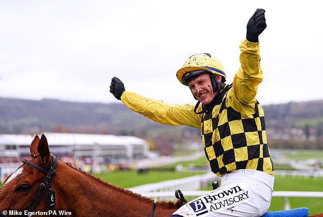 Townend raised his arms in celebration after victory at the Cheltenham Festival