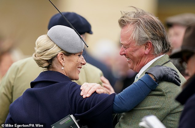 Zara looked in good spirits as she greeted friends on the first day of the 2024 Cheltenham Festival