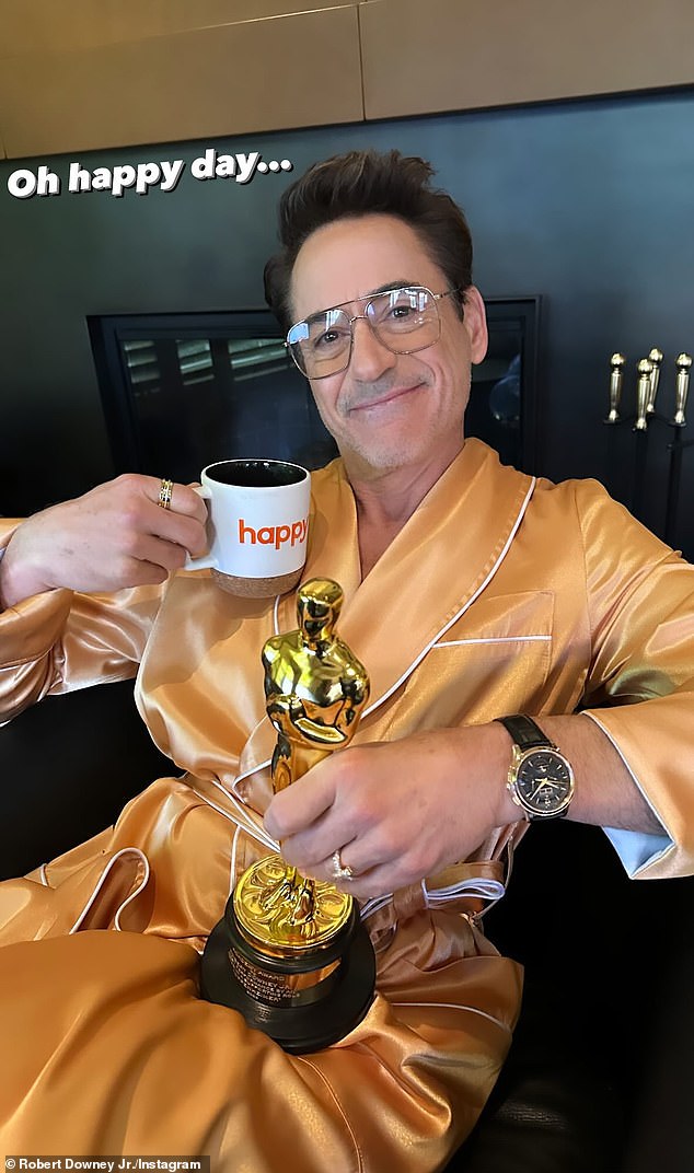 Robert – who boasts 113.5 million social media followers – posted a triumphant morning-after photo with his gold statue on Monday, captioning it: 'Oh happy day…'