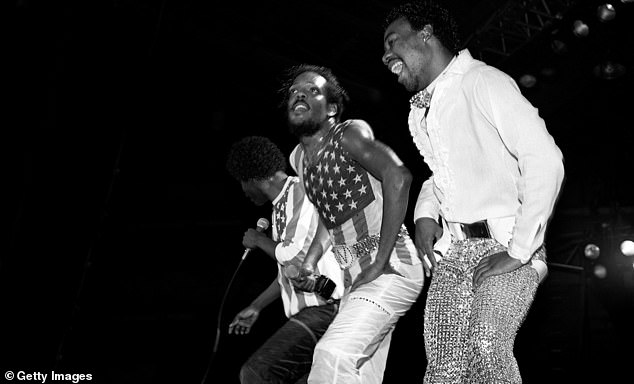 Singers and musicians Ronnie and Charlie Wilson of The Gap Band, and Anthony 'Baby Gap' Walker performing at the UIC Pavilion in Chicago, Illinois in January 1983