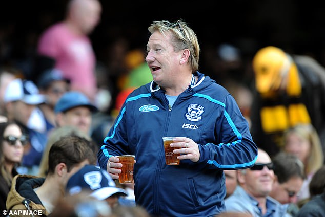 Beer drinkers at the MCG on game day won't be happy either - schooners cost $11.50 and Carlton Draft pints have increased from $12.50 to $13.50 (pictured, a Geelong fan)