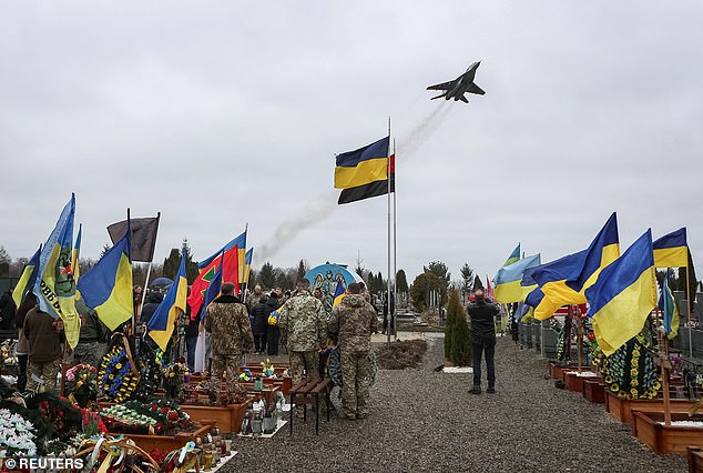 A fighter jet flies during a funeral of Ukrainian military fighter pilot Lieutenant Colonel Andrii Tkachenko, who was shot down while flying over the Donetsk region during the Russian attack on Ukraine