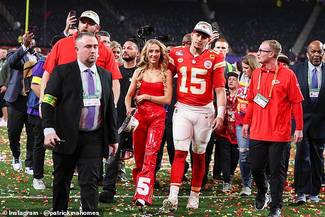 The high-profile couple walks onto the field at Allegiant Stadium after the Chiefs' Super Bowl victory