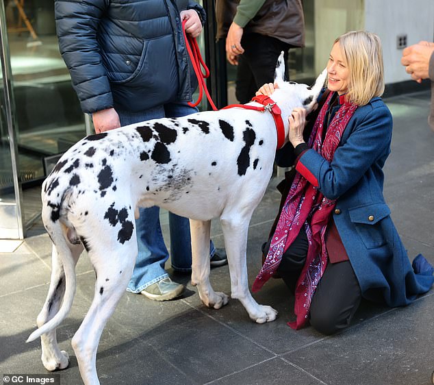 Naomi couldn't wipe the smile off her face as she enjoyed some precious moments with her four-legged companion