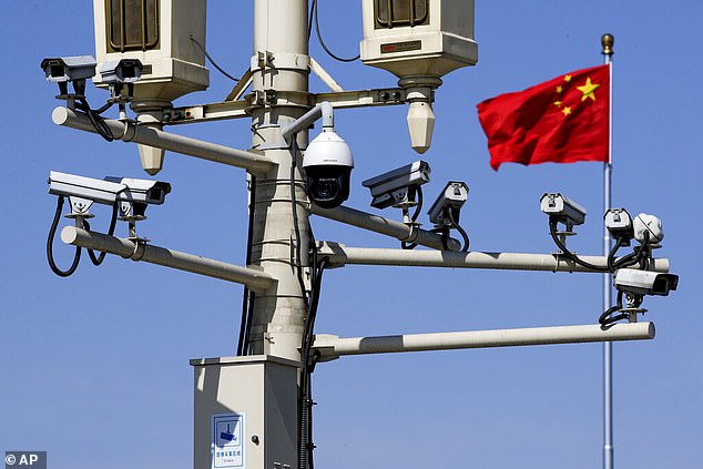 US President Joe Biden last month ordered the Commerce Department to investigate whether Chinese cars are collecting driver and passenger data with their cameras and sensors to capture detailed information about US infrastructure (pictured are surveillance cameras in Tiannanmen Square in Beijing)