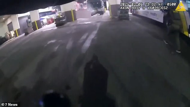 The bodycam footage shows one of the officers storming into the facility and running towards a bus