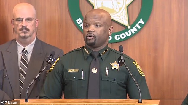 Molina used a hammer to destroy his cell phone and ambushed himself in an empty bus, Broward County Sheriff Gregory Tony (pictured) said during a news conference Friday