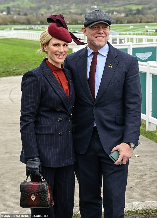 Equestrian Zara, 42, opted for an elegant double-breasted jacket with blue pinstripe and matching straight-leg trousers