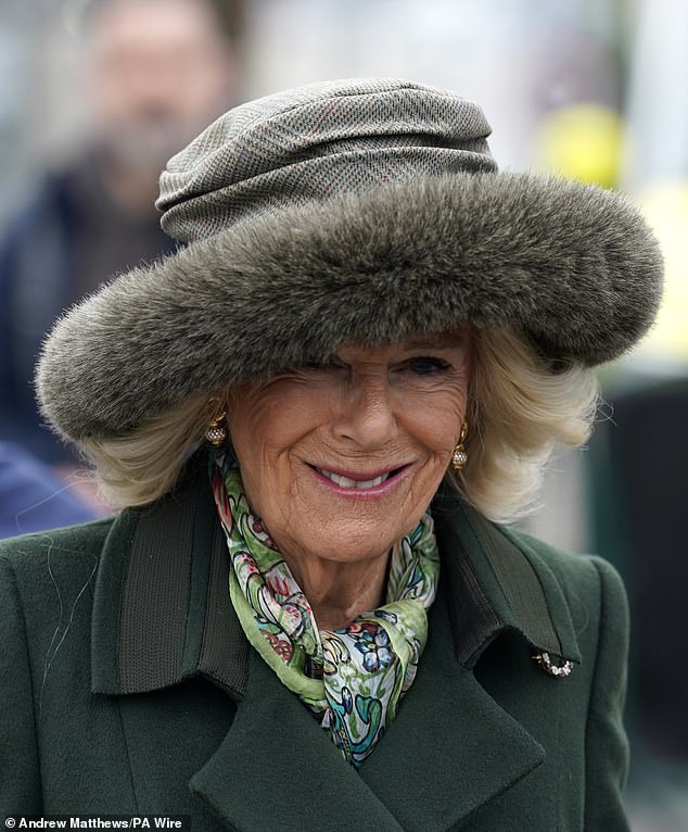 Despite the gloomy weather, the Queen beamed as she arrived at the racecourse for Style Wednesday this afternoon