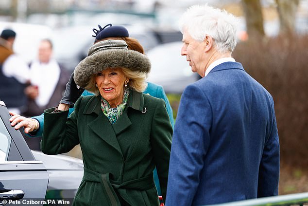 Hold on to your hats, Camilla!  The queen appeared to be caught in a sharp gust of wind as she stepped out of the car upon arrival