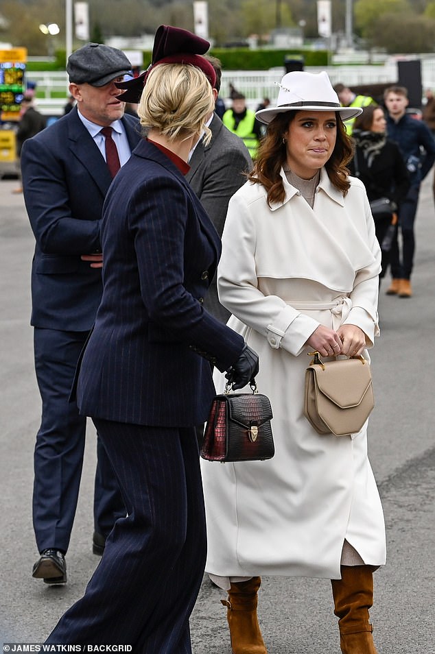 When she arrived at the racecourse, Eugenie posed for photos with her husband Jack Brooksbank, who was dressed in a light gray suit and green tie.