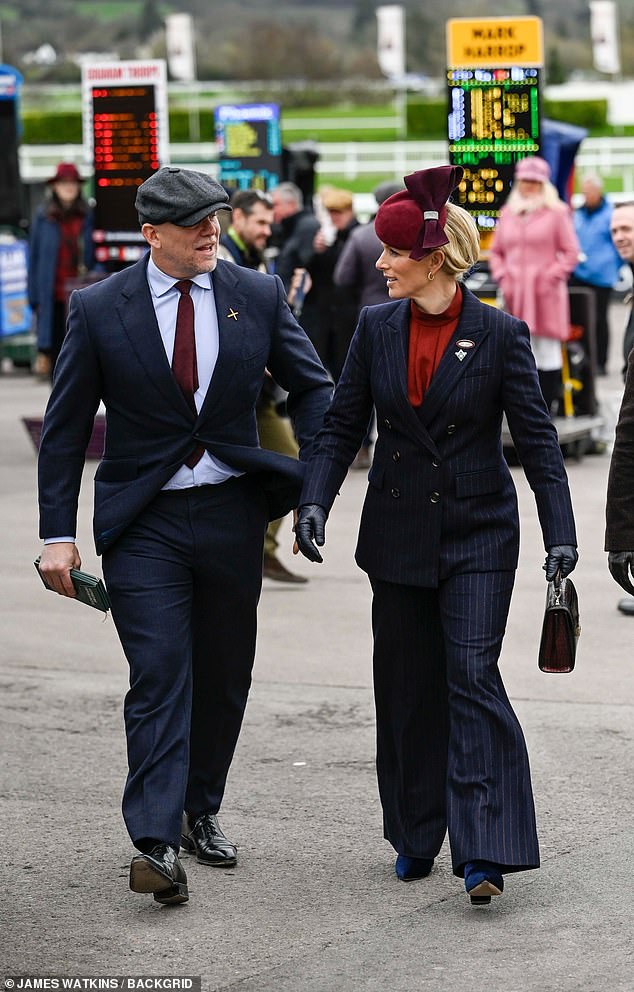 Princess Anne's daughter completed her ensemble with minimal gold jewelry and a chic burgundy suede fascinator