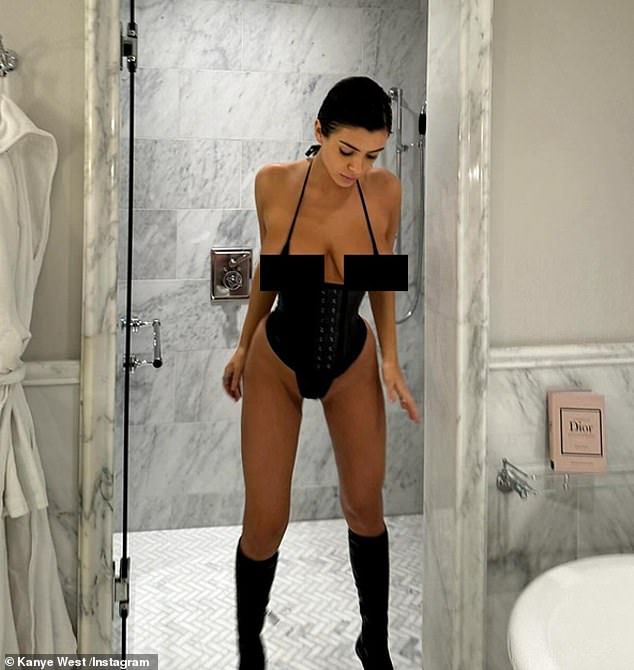 The designer has been pictured in a number of racy outfits since she started dating the rapper, but Kim 'credits' that she 'wears more layers' when the kids are around