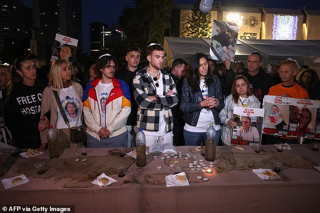 Former hostage Itay Regev pictured attending a protest by supporters and families of the Israeli hostage held in Gaza since October 7, gathered around a symbolic Shabbat dining table