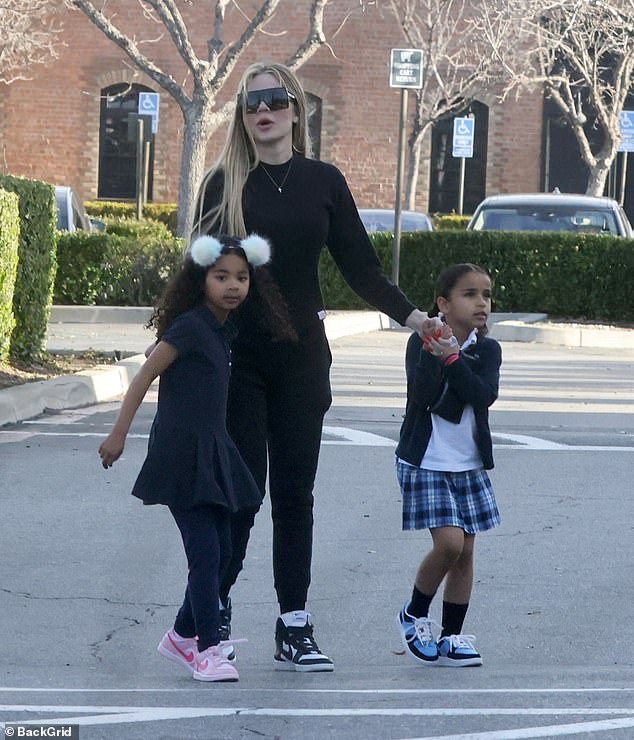 She held hands with True and Dream as they made their way through the ice cream shop parking lot