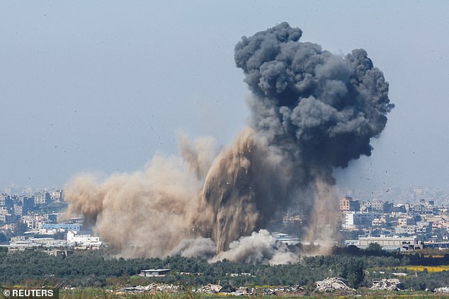 Smoke rises from an explosion in Gaza, amid the ongoing conflict between Israel and the Palestinian Islamist group Hamas, seen from Israel, March 13, 2024