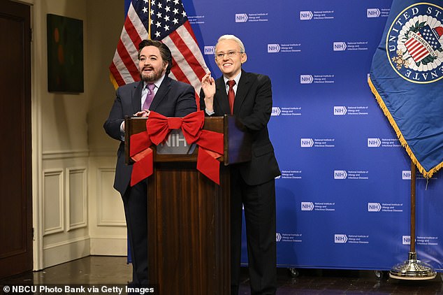 Bryant dons a fake beard while playing Cruz on SNL and she stands next to Kate McKinnon who plays Dr.  Anthony Fauci starred in a December 11, 2021 episode of SNL