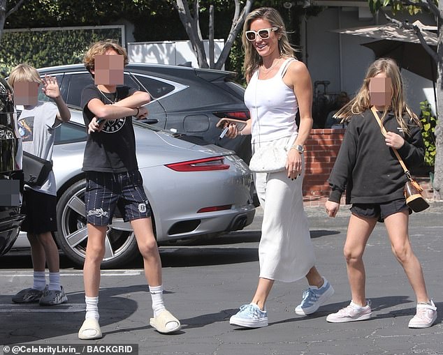 The 37-year-old mother of three - who shares Camden, 11, Jaxon, nine, and Saylor, eight, with ex-husband Jay Cutler - wore white for the outing