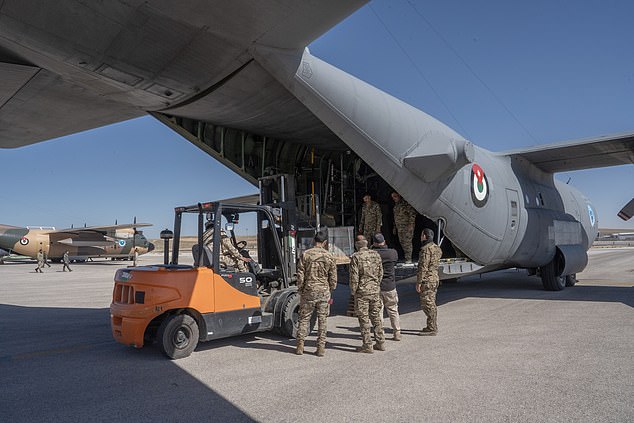 Aid is loaded into the C-130 by Jordanian pilots at King Abdullah II Air Base before it departs for Gaza