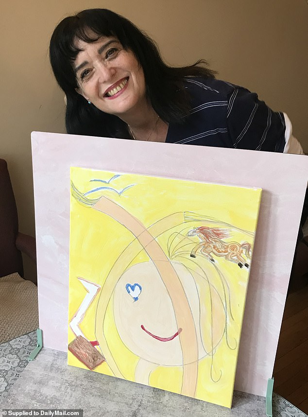 For Judith (pictured with her artwork) there is no reason to celebrate the release as she continues to worry about her family and every hostage held captive by Hamas.