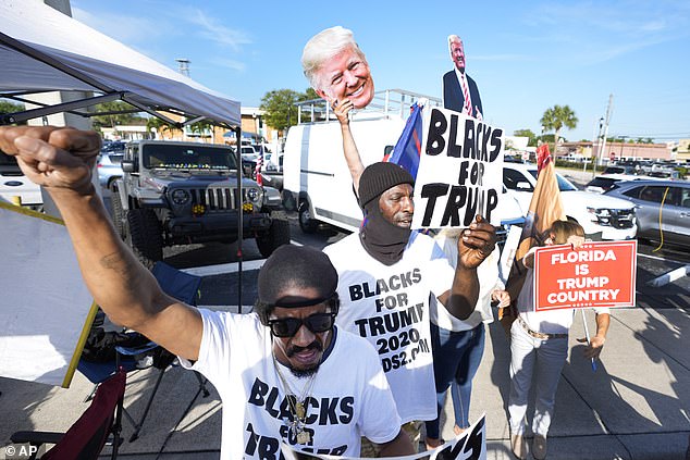 Supporters of former President Donald Trump cheer as he arrives at the federal courthouse