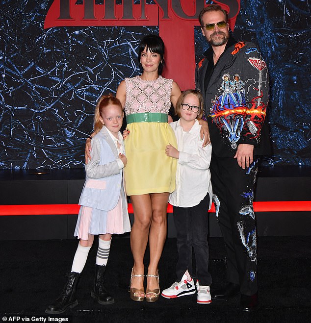 Lily shared: '(The US) is a much more encouraging environment for my children to thrive' (pictured with daughters Marnie, 12, and Ethel, 11, and husband David Harbour, 48, in 2022)