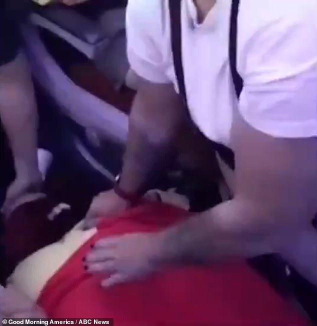 Fifty passengers were injured during the chaotic scenes, with 13 hospitalized with head and neck injuries and broken bones.  The photo shows an injured person during the flight