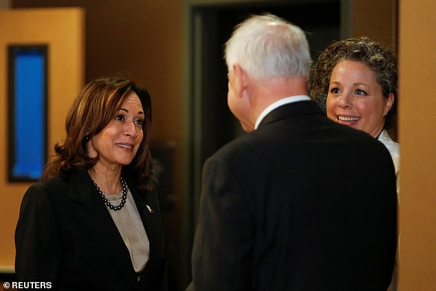 Harris speaks with Minnesota Governor Tim Walz and Dr. Sarah Traxler while visiting an abortion clinic in Minneapolis