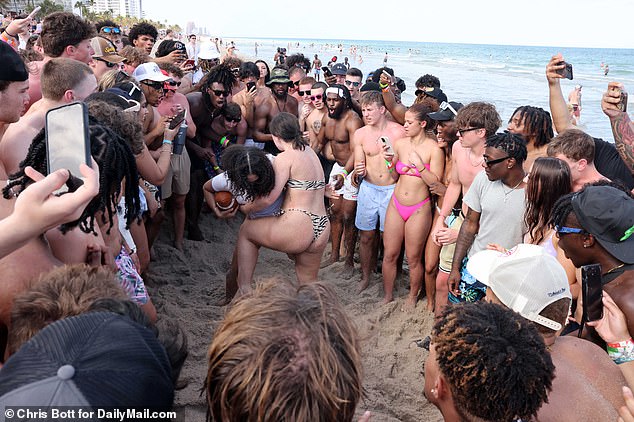 This week we see two girls wrestling on the sand of Fort Lauderdale Beach