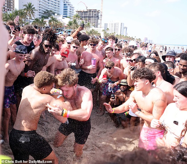 You see groups of boys jostling with each other as they are cheered on by friends