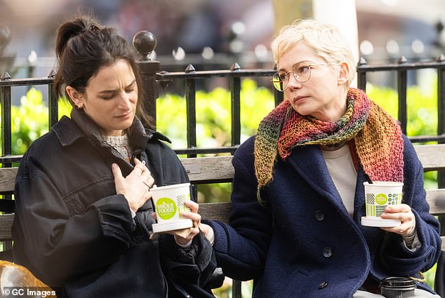 The Fabulous Man star wore a navy blue Pea Coat with a multi-colored scarf and wire-rimmed glasses