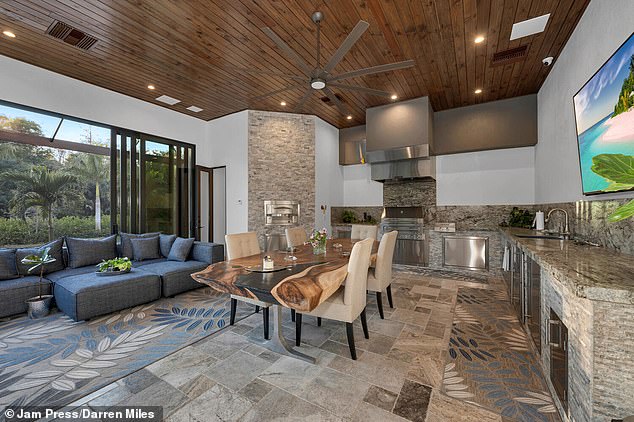 The kitchen features Cristallo quartzite countertops and Thermador appliances