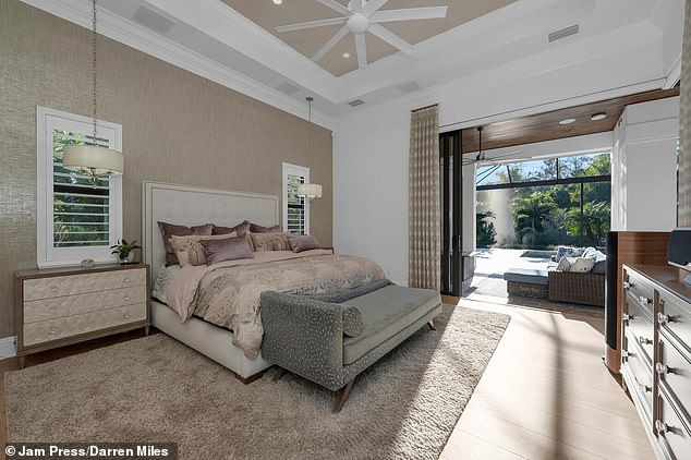 The master bedroom provides an airy reprieve in the expansive, high-tech property