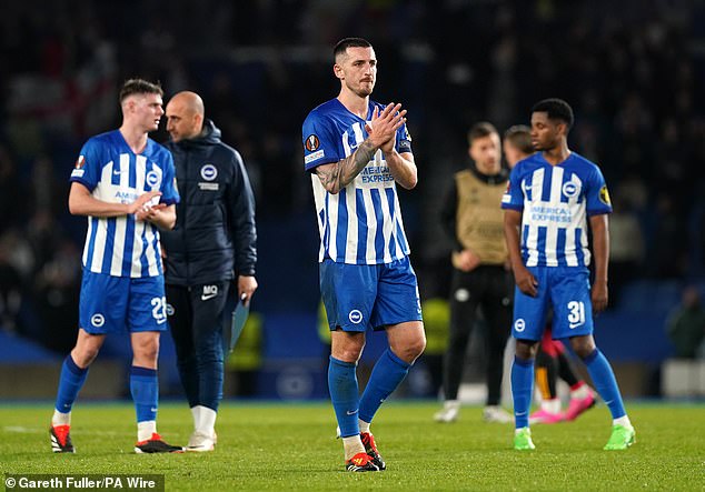 Lewis Dunk cheers on the fans after Brighton salvaged some pride with a 1-0 win on the night