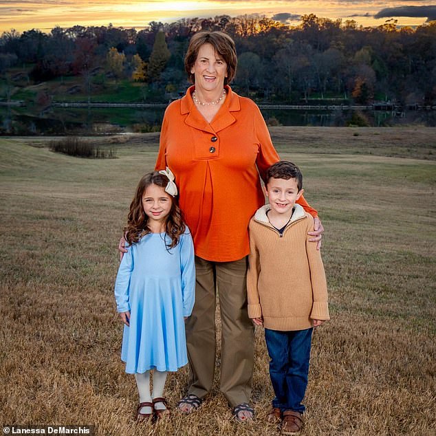 Arnett with her great-grandchildren on her property that is threatened by the highway