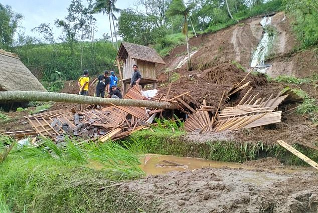 The couple was fast asleep when the landslide crushed their villa (damage pictured)