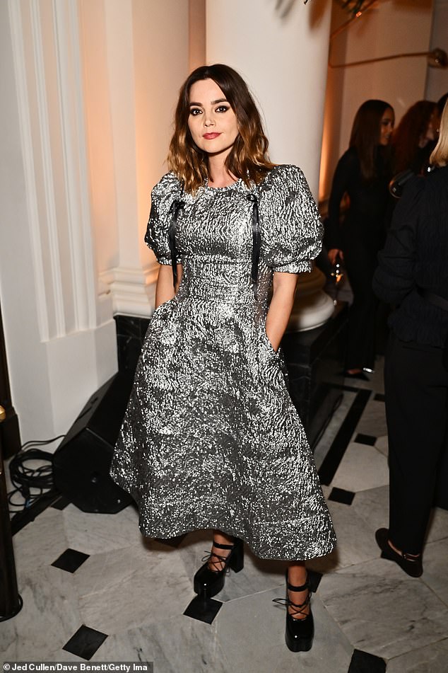 Jenna Coleman, 37, put on quite a show as she wore a statement metallic dress with peplum sleeves paired with lace platform heels