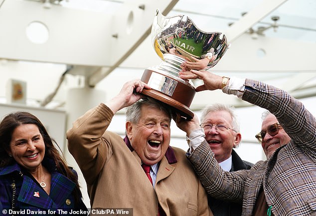 Owners John Hales (C) and Sir Alex Ferguson (second right) celebrate after Prokektorat wins the Ryanair Steeple Chas