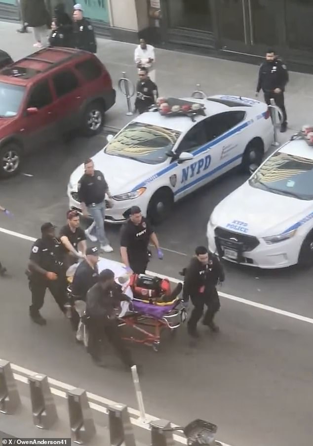 Footage posted by social media user Owen Anderson shows emergency workers rushing the person on a wheeled stretcher to an ambulance